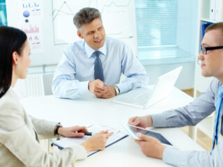 Business team discussing ideas at meeting in office